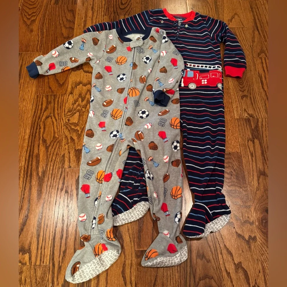Pair of Carter's fleece PJs with zipper and footies.  Size 24 Months